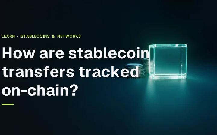 The title How are stablecoin transfers tracked on-chain over blank coins, a glowing glass block and a screen on dark navy.