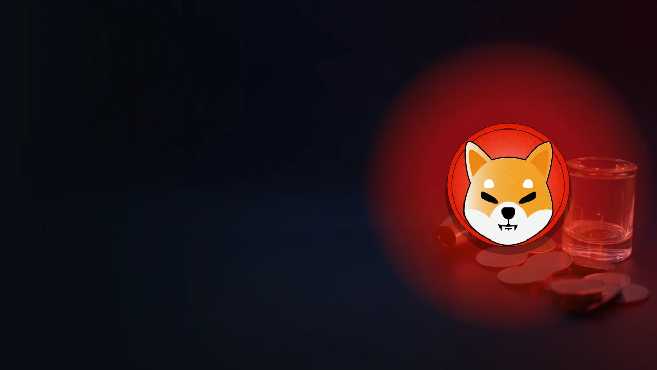 빈 토큰과 유리 원통이 있는 어두운 배경 위의 Shiba Inu 로고.