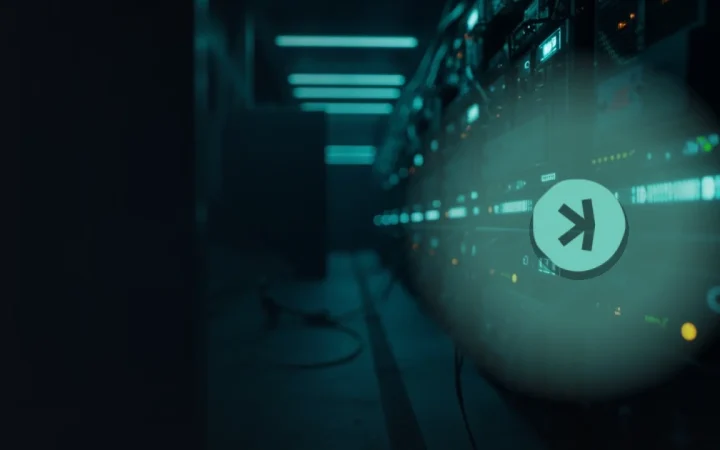 The Kaspa logo over a dark navy background with glowing teal server racks on the right.