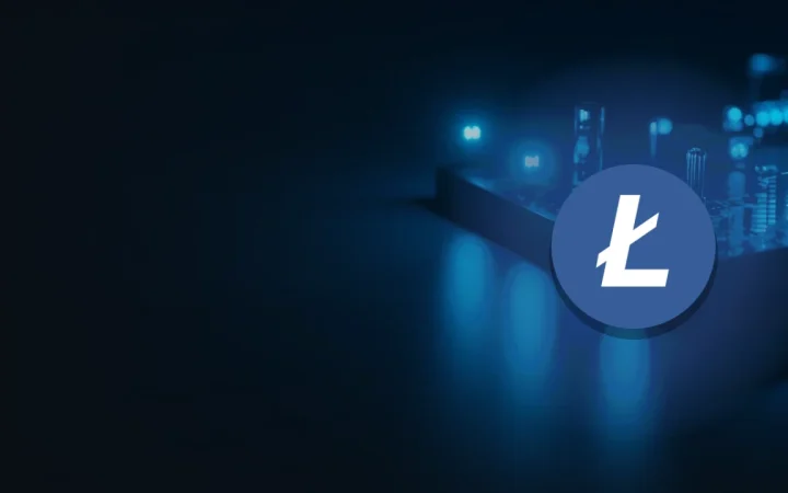 The Litecoin logo over a dark navy desk of glowing blue bars and indicator lights.
