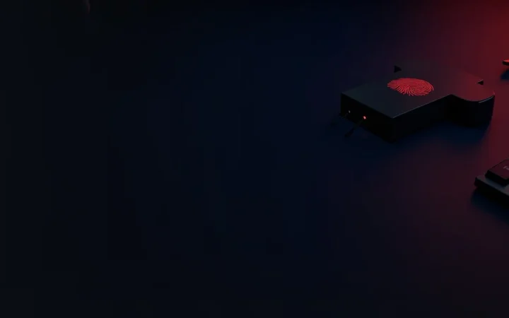 Un escritorio azul marino oscuro con un lector de huellas rojo brillante, una llave de seguridad y un teclado en blanco, con el lado izquierdo vacío y oscuro.