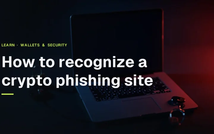 How to recognize a crypto phishing site title over a dark desk with a laptop, a security key and a padlock in red light.