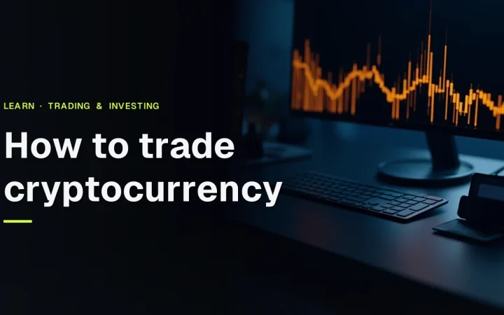The title How to trade cryptocurrency over a dark desk with a glowing monitor, blank keypad, blank card, and a hardware wallet.