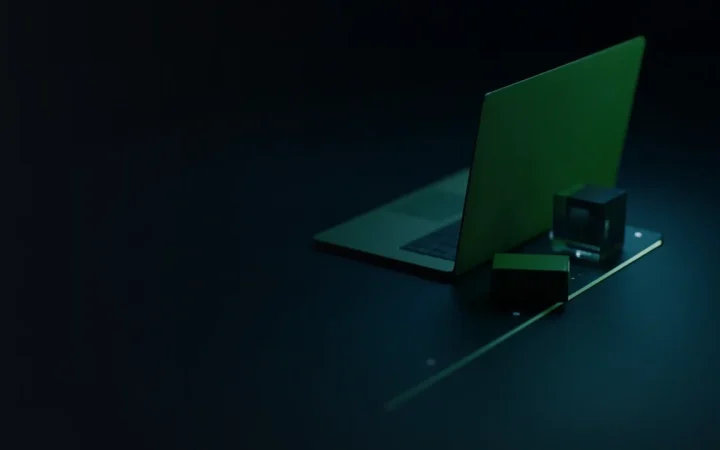 A dark desk with a glowing laptop, a blank hardware wallet and a glass block linked by light.