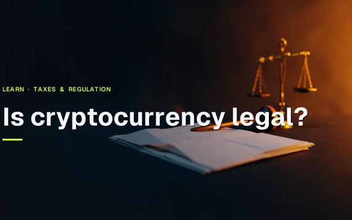 The title Is cryptocurrency legal? over a dark desk with a gavel, blank forms, a folder and a scale in warm orange light