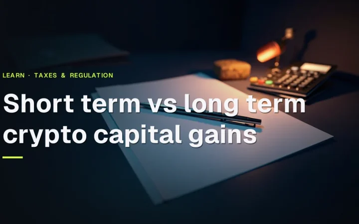 The title Short term vs long term crypto capital gains over blank tax forms, a folder, a pen and a calculator on a dark navy desk.