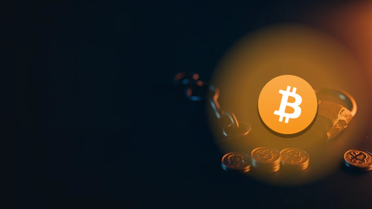 The Bitcoin logo over a dark navy background of glowing orange coins, a broken chain and a cracked padlock.