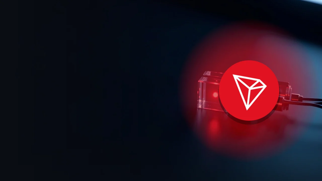 The TRON logo over glowing red glass blocks joined by light on a dark navy background.