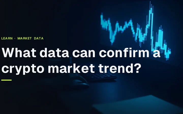 Titlen 'What data can confirm a crypto market trend?' over et mørkt skrivebord med glødende blå diagrammer på skærme.