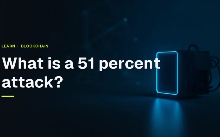 The title What is a 51 percent attack appears over a dark mining rig with a blank glowing screen and faint block chain shapes.