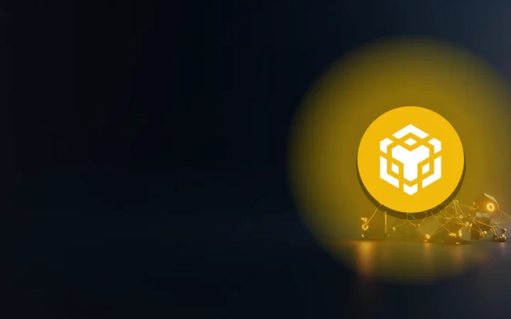 BNB-logotypen mot en mörkblå bakgrund med glödande guldfärgade glasblock sammanlänkade av ljus.