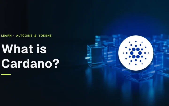 The title What is Cardano? and the Cardano logo over glass blocks joined by glowing blue light on a dark navy background.