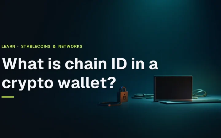 The title What is chain ID in a crypto wallet? over a dark navy desk with a blank-screen wallet, padlock and cables in teal light.