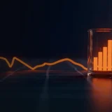 A dark navy background with two glowing orange price lines diverging and blank tokens.