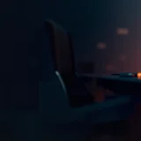 A dark desk with glowing orange chart bars and a small server.
