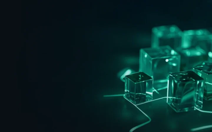 A dark navy background with glass cubes joined by glowing green lines on the right.