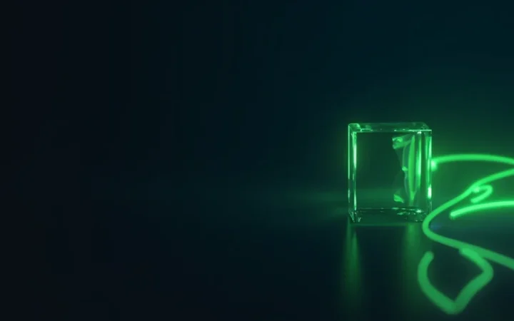 A dark navy background with glass blocks joined by lime green light.