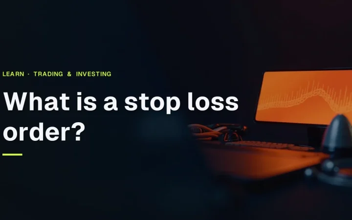 The title What is a stop loss order sits over a dark navy desk with a glowing orange terminal and abstract bars.
