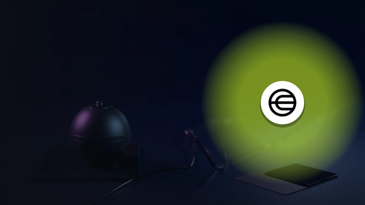 Das Worldcoin-Logo vor einem dunkelblauen Hintergrund mit einer leuchtenden Metallkugel auf der rechten Seite.