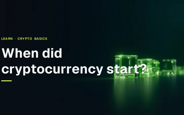 The title When did cryptocurrency start? over a dark navy background with a glowing lime green chain of glass blocks on the right.