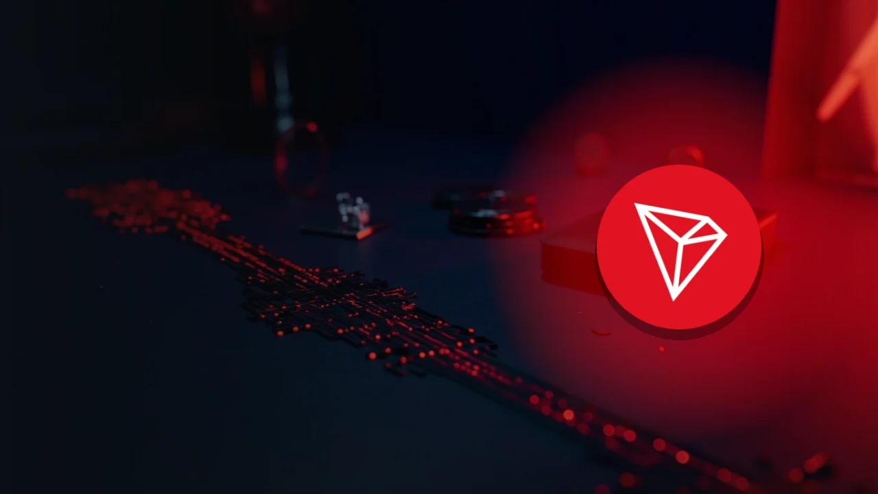 TRON-logotypen över ett mörkt marinblått skrivbord med tomma metallpolletter, ett glasblock och en hårdvaruplånbok.