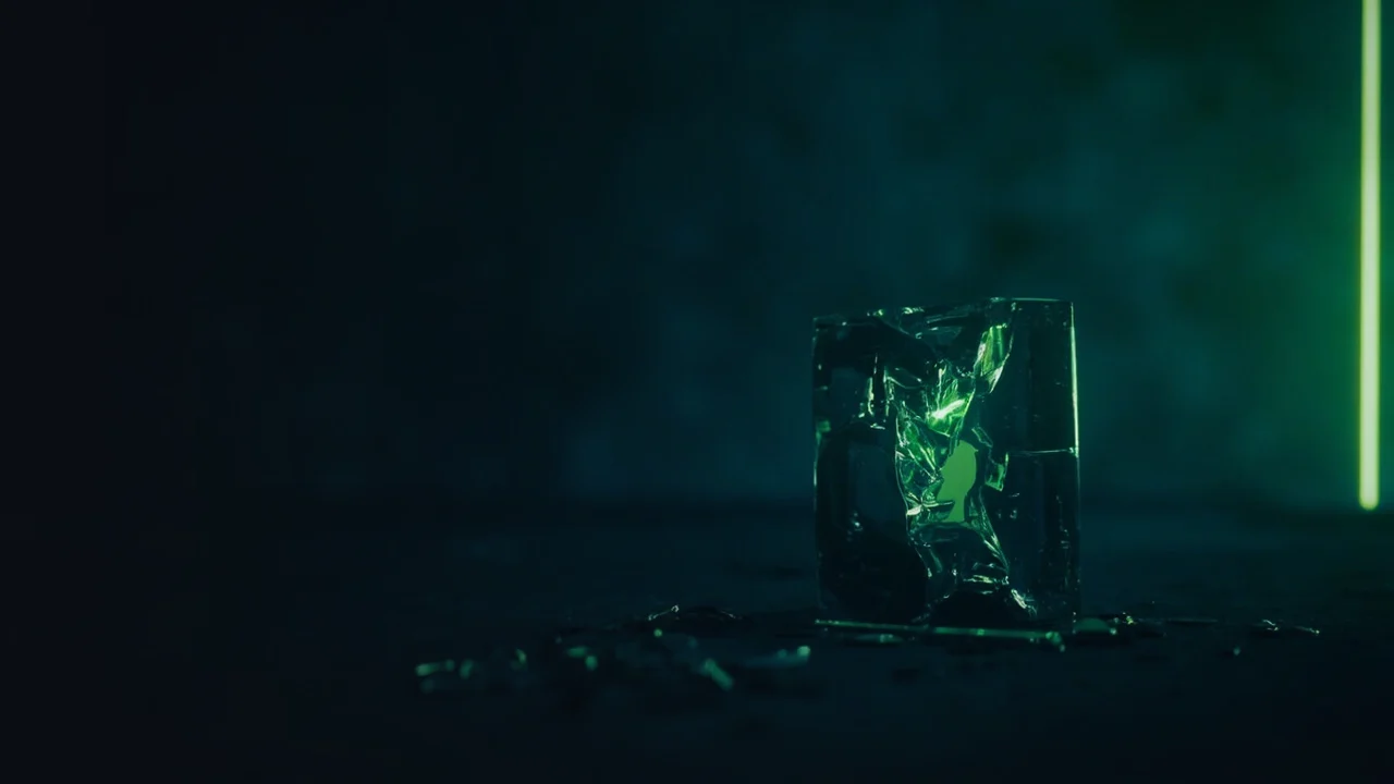 A dark navy background with a broken glass chain, a cracked padlock and scattered blank coins on the right.